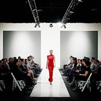 model in gown walking down catwalk at fashion show - fashion week stock pictures, royalty-free photos & images