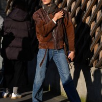 Model is seen wearing a brown jacket, blue jeans and headscarf outside the Stella McCartney show during the Womenswear Fall/Winter 2025/2026 as part...