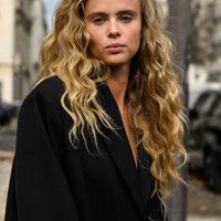 Model Olivia O. Vinten is seen wearing a black blazer outside the Chanel show during the Womenswear Spring/Summer 2024 as part of Paris Fashion Week...
