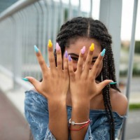 model on city bridge posing with colorful nails - fashion stock pictures, royalty-free photos & images