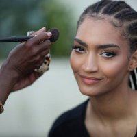 Model prepares backstage before the LaQuan Smith fashion show during the September 2024 New York Fashion Week on September 09, 2024 in New York City.