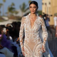Model presents a creation of Saudi designer Tima Abid during the Red Sea Fashion Week in Saudi Arabia's Red Sea resort of Ummahat Island, on May 16,...