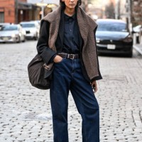 Model Summer Zoe Thompson is seen wearing a black jacket, black shirt, blue jeans, brown belt, brown shoes and brown sweater outside the Ashlyn show...