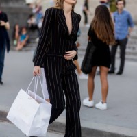 Model wearing a striped suit and shopping bag outside Alexandre Vauthier during Paris Fashion Week - Haute Couture Fall/Winter 2017-2018 : Day Three...