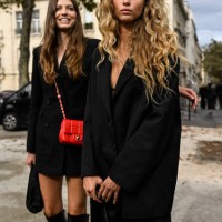 Models Mathilde Henning and Olivia O. Vinten are seen wearing black jackets outside the Chanel show during the Womenswear Spring/Summer 2024 as part...