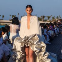 Models present creations of Saudi designer Tima Abid during a show at the Red Sea Fashion Week in Saudi Arabia's Ummahat Island on May 16, 2024.
