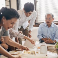 modern family eating take-out food together - junk food stock pictures, royalty-free photos & images