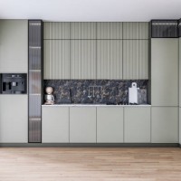 modern khaki green kitchen with a space (for an island or a table) on the hardwood floors and a large open window door with a garden view on the side - garden decoration stock pictures, royalty-free photos & images