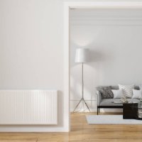 modern living room interior with radiator on blank wall, sofa, coffee table and floor lamp - home decoration stock pictures, royalty-free photos & images