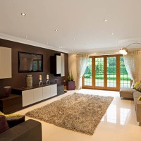 modern living room space with purple, green, and brown decor - garden decoration stock pictures, royalty-free photos & images