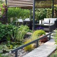 modern patio garden lounge with a pond and outdoor sofas - home decoration stock pictures, royalty-free photos & images