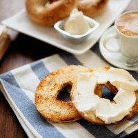 montreal style bagels on a plate with cream cheese and coffee - food stock pictures, royalty-free photos & images