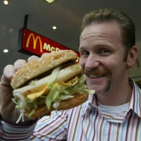 Morgan Spurlock of the documentary 'Super Size Me', where he ate only McDonald's for 30 days, shown with a Big Mac, 26 May 2004. SMH Picture by...