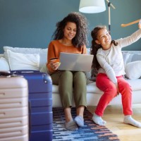 mother and daughter choosing their next vacation destination - travel stock pictures, royalty-free photos & images