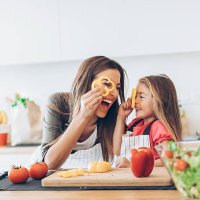 mother and daughter having fun with the vegetables - food stock pictures, royalty-free photos & images