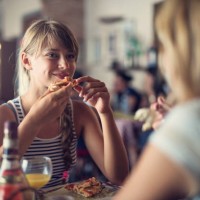 mother and daughter having pizza in piza restaurant - food stock pictures, royalty-free photos & images