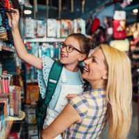 mother and daughter in a bookstore - home decoration stock pictures, royalty-free photos & images