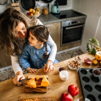 mother and daughter preparing different sweet holiday treats - home decoration stock pictures, royalty-free photos & images