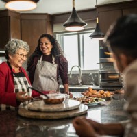 mother and daughter preparing food for family at kitchen at home - food stock pictures, royalty-free photos & images