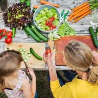 mother and daughter preparing salad - food stock pictures, royalty-free photos & images