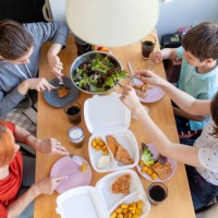 mother and her children at the table eating fast food delivered - junk food stock pictures, royalty-free photos & images