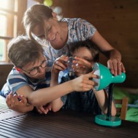 mother and kids saving energy by changing bulbs - home decoration stock pictures, royalty-free photos & images