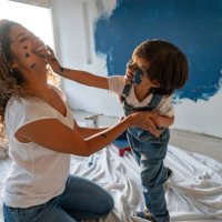 mother and son painting their house and having fun - home decoration stock pictures, royalty-free photos & images