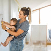 mother and son painting wall - home decoration stock pictures, royalty-free photos & images