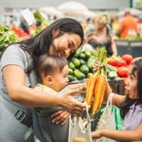 mother with kids shopping in market - food stock pictures, royalty-free photos & images
