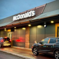 Motorists queue to use the Drive Thru hatch of the fast food restaurant McDonald's, on October 18, 2023 in Bristol, England. Founded in 1940,...