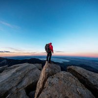 mountain man on a summit - travel stock pictures, royalty-free photos & images