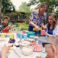 multi- generation family enjoying garden party celebration meal together - garden decoration stock pictures, royalty-free photos & images