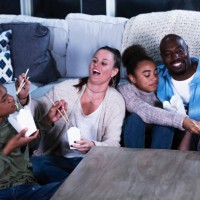 multi-ethnic blended family eating chinese take out food - junk food stock pictures, royalty-free photos & images