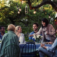multi-ethnic friends enjoying dinner party at yard - garden decoration stock pictures, royalty-free photos & images