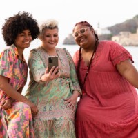 multi-ethnic friends taking a selfie smiling next to the sea - fashion stock pictures, royalty-free photos & images