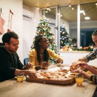 multi-ethnic group of friends enjoying pizza together - junk food stock pictures, royalty-free photos & images
