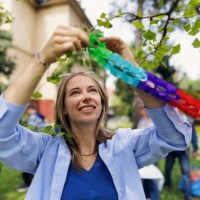 multi-generation family preparing garden party celebration - garden decoration stock pictures, royalty-free photos & images