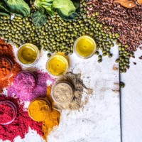 multi colored vegetables, fruits, legumes and spices on wooden table - food stockfoto's en -beelden