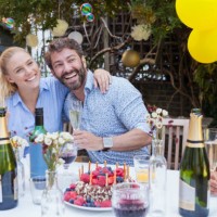 multi generation family enjoying birthday party at garden patio table - garden decoration stock pictures, royalty-free photos & images
