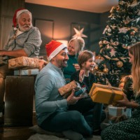 multigeneration family on the living room exchancing christmas presents - home decoration stock pictures, royalty-free photos & images