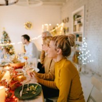 multigenerational family celebrating december holidays - food stock pictures, royalty-free photos & images