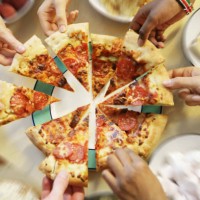 multiple hands reaching for pizza slices - junk food stock pictures, royalty-free photos & images