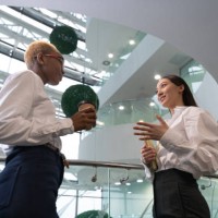 multiracial businesswomen talking during break - junk food stock pictures, royalty-free photos & images