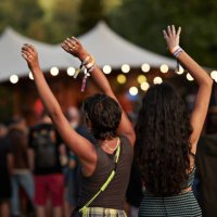 multiracial female friends dancing with arms raised - concert stock pictures, royalty-free photos & images
