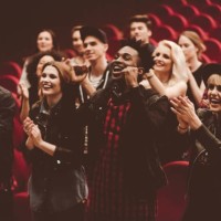 multiracial group of people in the movie theater - concert stock pictures, royalty-free photos & images