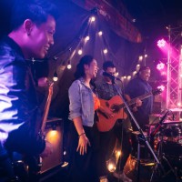 music band performing on stage in night club. - concert stock pictures, royalty-free photos & images