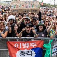 Music fans wait to see K-Pop group Seventeen perform on the Pyramid Stage during day three of Glastonbury Festival 2024 at Worthy Farm, Pilton on...