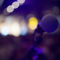 musical microphone on a concert stage - concert stock pictures, royalty-free photos & images