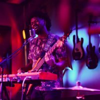 musician performing on stage with guitar - concert stock pictures, royalty-free photos & images