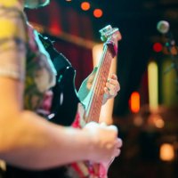 musicians playing guitar on stage - concert stock pictures, royalty-free photos & images